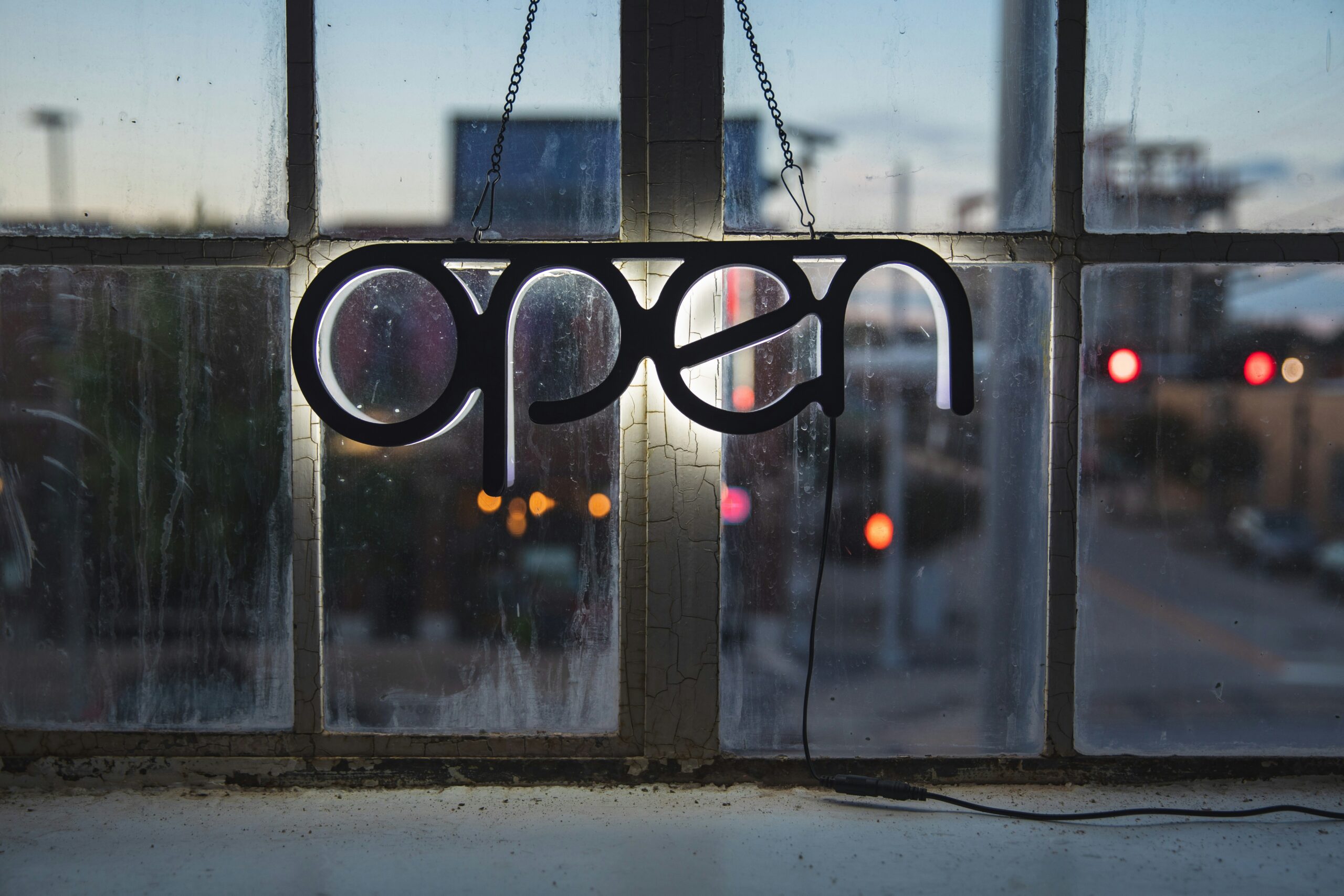 picture of a window with an open sign