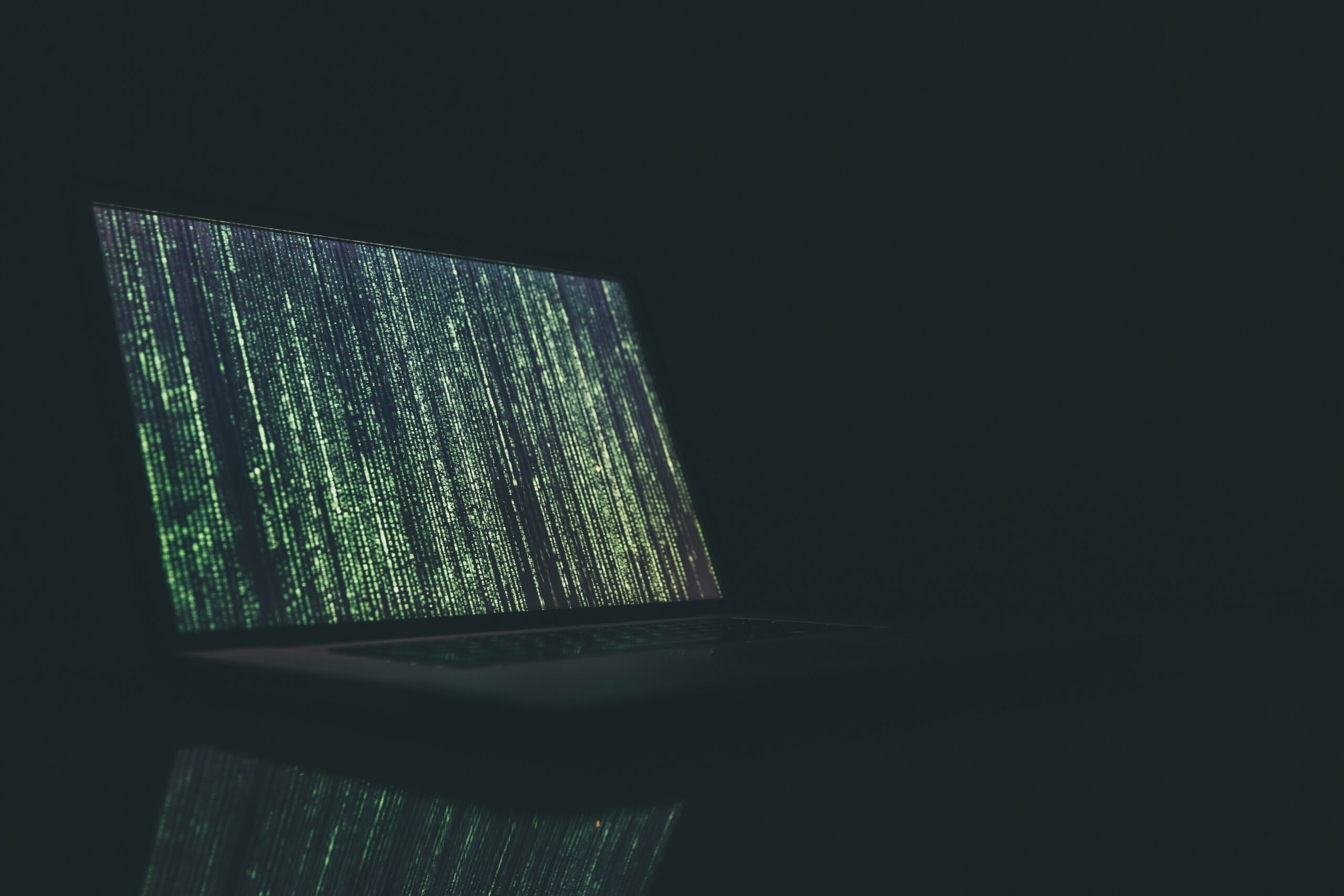picture of a computer with encryted letters on the screen